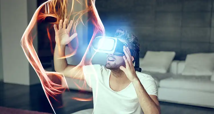 Brunette man wearing VR headset reaching up to touch the body of a woman which is vaguely illustrated in front of him.